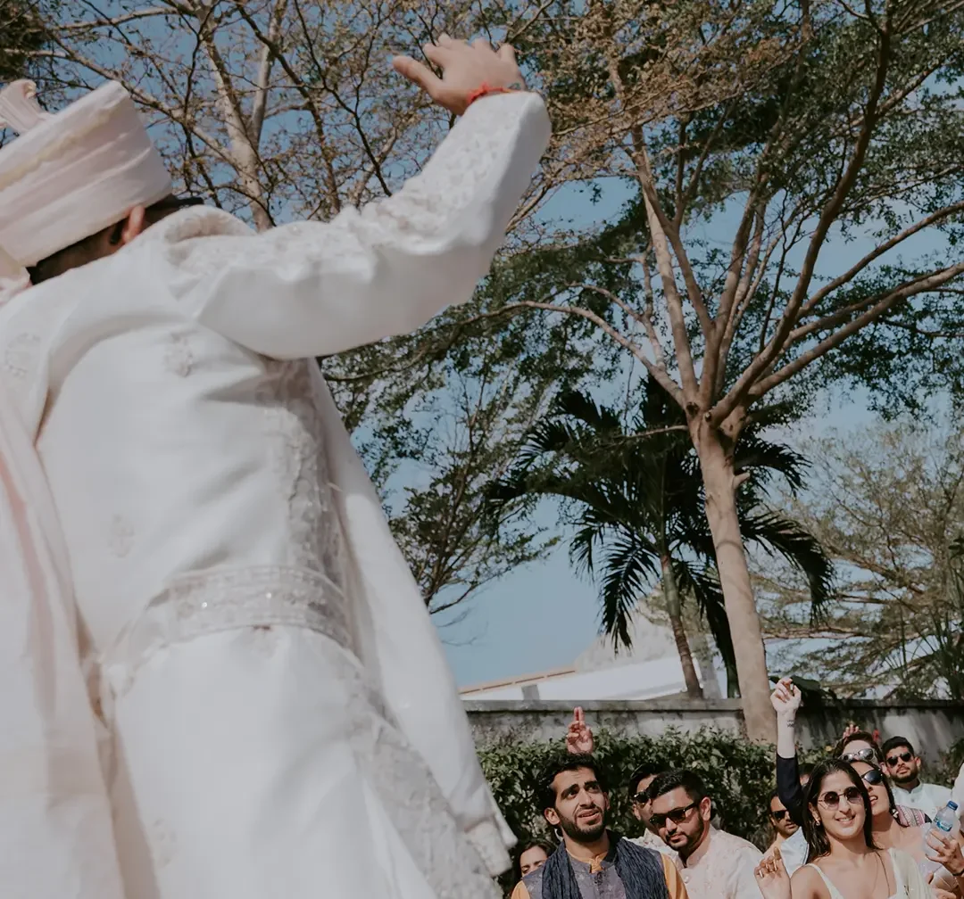Cultural Indian wedding venue in Bali with a bride enjoying an outdoor celebration surrounded by tropical greenery, supported by a DMC Bali