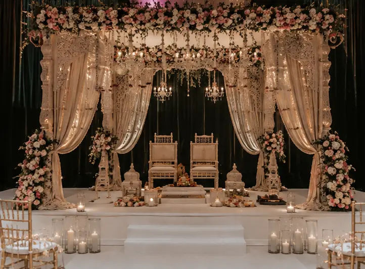 Traditional mandap featuring floral arrangements, draped textiles, and Balinese-inspired indian wedding decorations